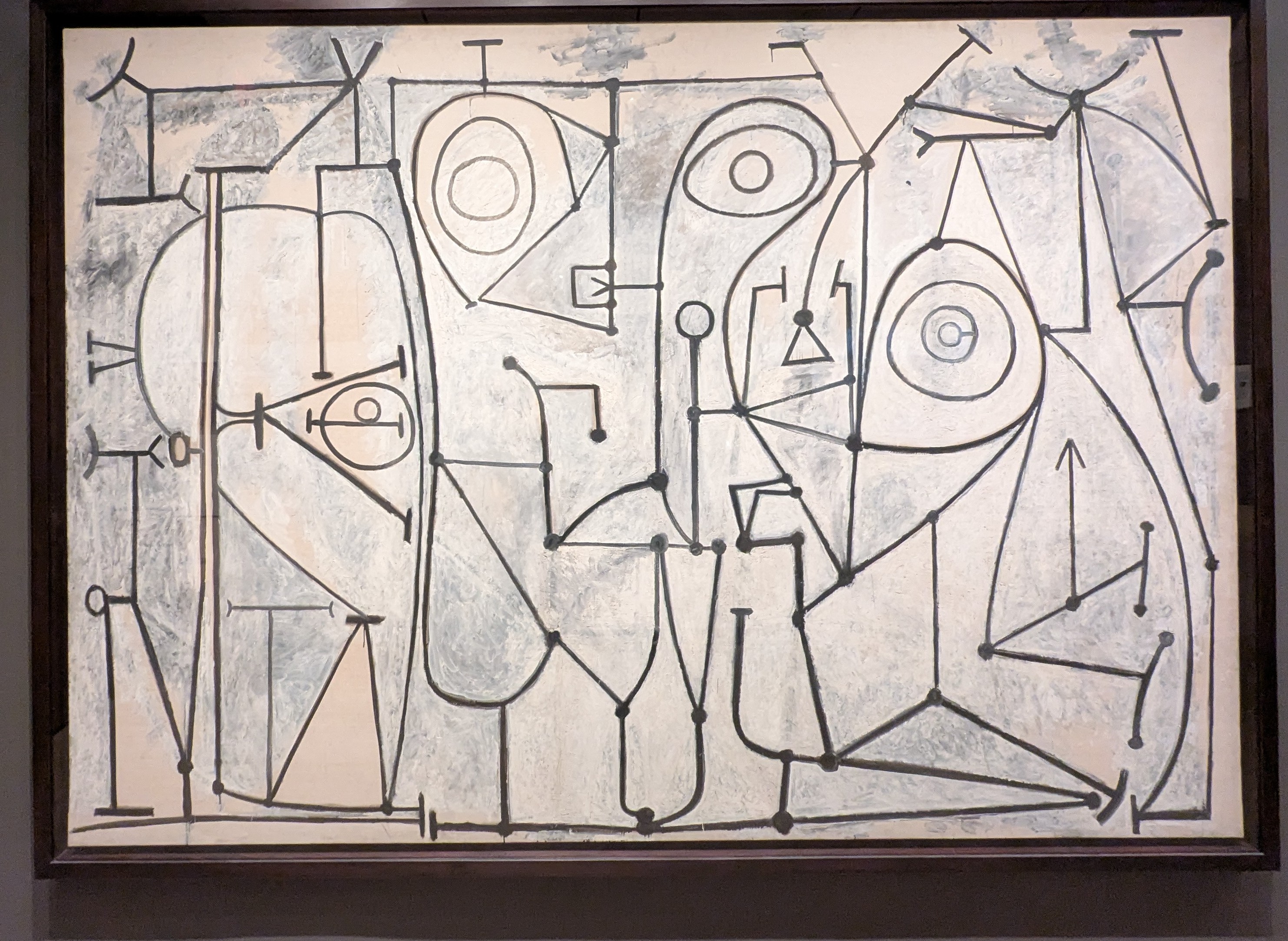 Picasso's 1948 painting "The Kitchen." Flat angular lines cover and intersect a beige surface. They could be figures or birds or I guess parts of a kitchen
